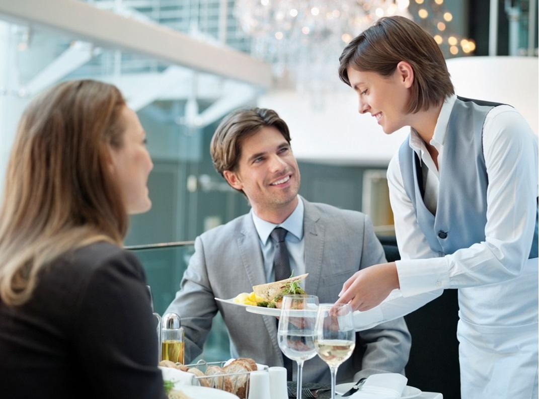 Girl at St. Patrick's Day parade wearing a hat with Irish flag colors